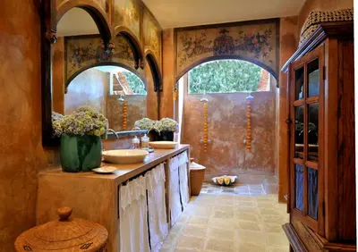 a bathroom with two sinks and two mirrors at Villa Bella Bali - Authentic Balinese Luxury Villa with Tropical Elegance - Nanny and Cook in Canggu