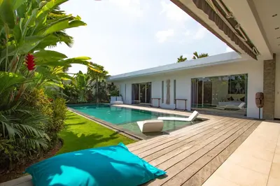 an image of a backyard with a swimming pool and a house at Villa Juna - Beautiful 3 Bedroom in Seminyak in Seminyak