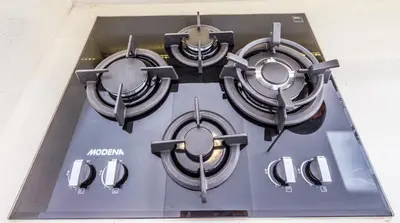 a close up of a stove top with four at Villa Juna - Beautiful 3 Bedroom in Seminyak in Seminyak
