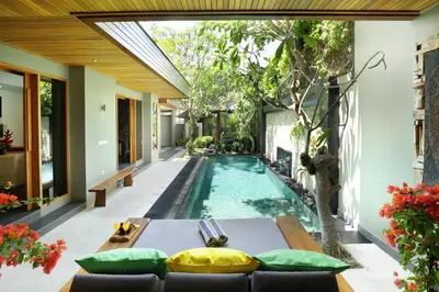 an infinity pool in the backyard of a villa at Villa the Hotman Paris I Seminyak in Seminyak