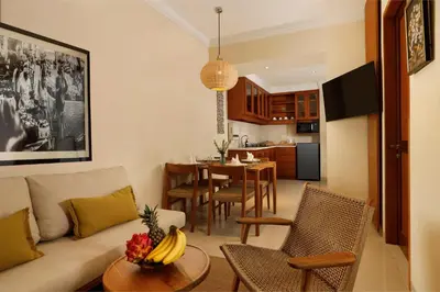 a living room with a couch and a table at Sara Residence by Nakula in Legian