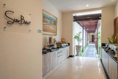 a kitchen with a counter and a counter top at Swiss-Belcourt Sunset in Seminyak