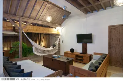 a living room with a hammock and a tv at 3BR Villa Rabu - Minggu Villas Seminyak in Seminyak