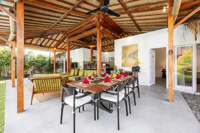 a dining room with a table and chairs at Renovated Villa Gladak, 200m to Oberoi Seminyak in Seminyak