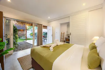 a bedroom with a bed with a towel on it at Renovated Villa Gladak, 200m to Oberoi Seminyak in Seminyak