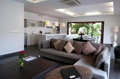 a living room with a couch and a table at Nunia Boutique Villa in Seminyak