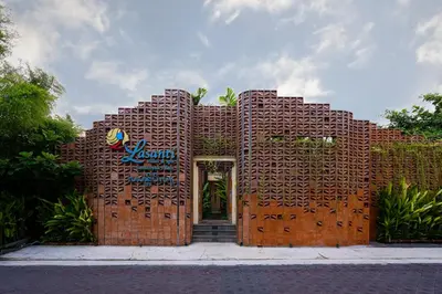 a brick building with a sign on it at Lasanti Villas Seminyak in Seminyak