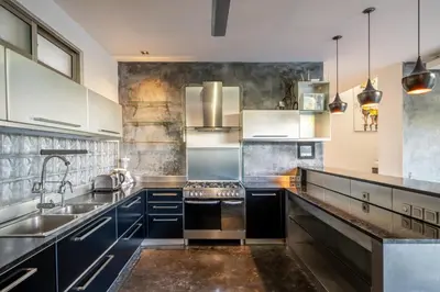 a kitchen with stainless steel appliances and a sink at Villa Onyx in Seminyak