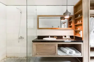 a bathroom with a sink and a shower at Dasa Villa in Seminyak