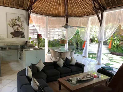 a living room with a couch and a table at Esha Villa Umalas 2 in Kerobokan