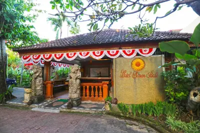a small shrine in front of a house at Hotel Sinar Bali Legian in Legian