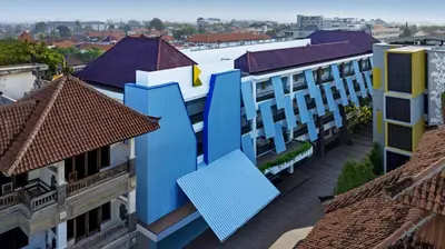 an overhead view of a building with blue roofs at Kampi Hotel Legian in Legian