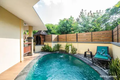 a swimming pool in the backyard of a house at Bali Ayu Hotel & Villas in Seminyak