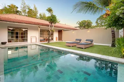 a swimming pool in the backyard of a villa at Uma Sapna Seminyak in Seminyak