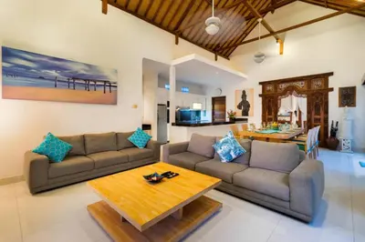 a living room with two couches and a table at Super Value 3 Bed, Central Seminyak, Walk to Beach in Seminyak