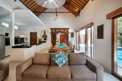 a living room with a couch and a table at Super Value 3 Bed, Central Seminyak, Walk to Beach in Seminyak