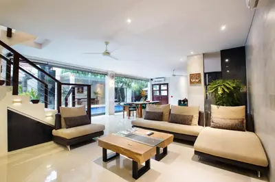 a living room with a couch and a table at Sunset Paradise Jimbaran 3003 in Jimbaran