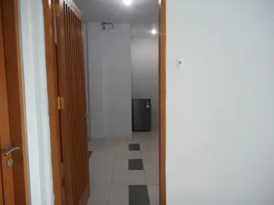 an empty hallway with a hallway at Grand Sinar Indah in Legian