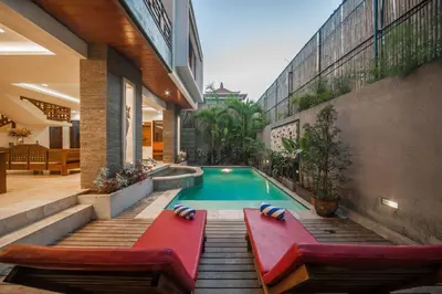 a swimming pool in the backyard of a house at Villa Suzuki 1 Seminyak in Seminyak