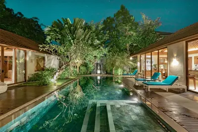 a swimming pool in the middle of a house at The Akasha Seminyak Bali Luxury Villas in Seminyak