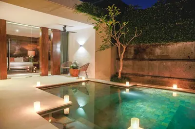 a swimming pool in the middle of a room at Villa 80361 in Seminyak
