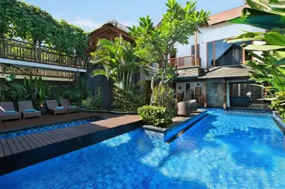 a swimming pool in the backyard of a house at Villa Blue in Seminyak