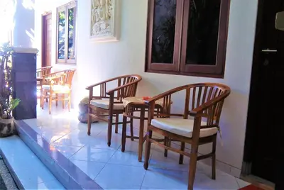 a group of chairs and a table in a room at Anantaya Home Denpasar in Denpasar