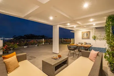 an outdoor patio with a table and chairs at Cove Villa Prana in Jimbaran