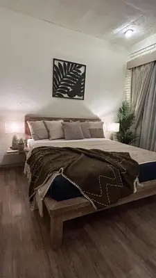 a bedroom with a large bed in a room at Artemis Villa Hotel in Seminyak