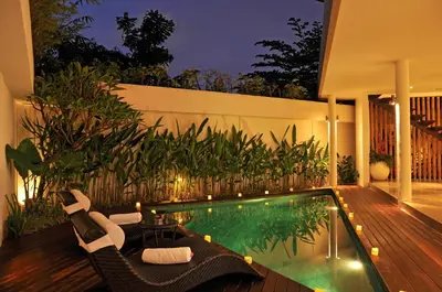 a swimming pool in the middle of a house at Villa La Sirena by Nagisa Bali in Seminyak