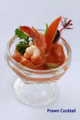 a glass bowl of food with shrimp in it at The Lokha Legian Resort & Spa in Legian
