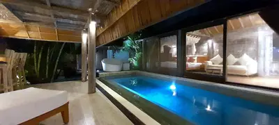 a swimming pool in a house with a living room at PROMO! Private Vacation Rentals Villa, 2 Pools,4 Bedrooms,4 Bathrooms, Bali Seminyak in Seminyak