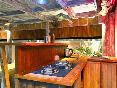 a kitchen with a wooden island with a stove at PROMO! Private Vacation Rentals Villa, 2 Pools,4 Bedrooms,4 Bathrooms, Bali Seminyak in Seminyak