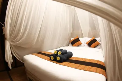 a bed with two stuffed animals on top of it at PROMO! Private Vacation Rentals Villa, 2 Pools,4 Bedrooms,4 Bathrooms, Bali Seminyak in Seminyak