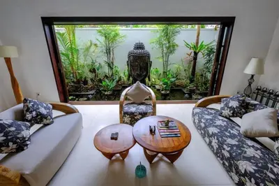 a living room with a couch and a table at Villa Eva in Seminyak