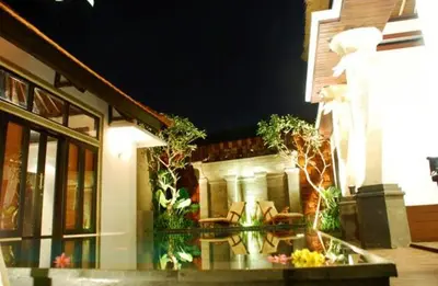 a house with a glass table in front of it at Villa Cantik Tresna in Seminyak