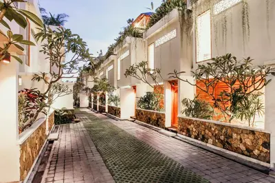 an empty street in a town with buildings at Villa Kayu Raja in Seminyak