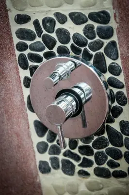 a close up of a water tap on a rock gmaxwell gmaxwell gmaxwell gmaxwell gmaxwell gmaxwell at Pearl Boutique Hotel Adult only in Legian