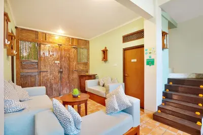 a living room with a couch and a table at The Vie Villa Legian in Legian