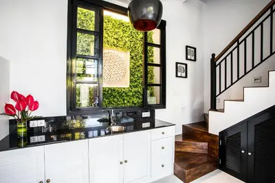 a bathroom with a sink and a window at Villa Pulau Rumah in Seminyak