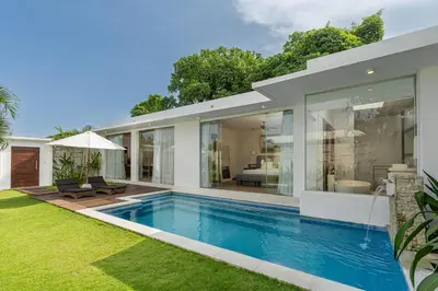 a swimming pool in the backyard of a house at The Daha Luxury Villas in Seminyak