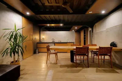 a dining room with a table and chairs at Clio Apartment in Seminyak