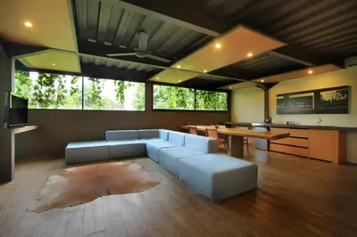 a living room with a couch and a table at Clio Apartment in Seminyak