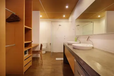 a bathroom with two sinks on a counter at Clio Apartment in Seminyak