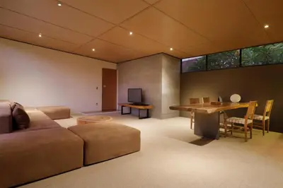 a living room with a couch and a table at Clio Apartment in Seminyak