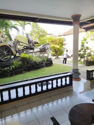 a car that is laying on the ground at La Walon Hotel in Kuta