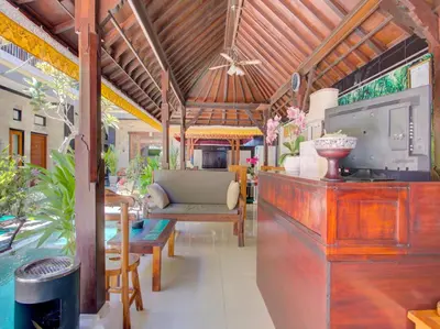 a living room with a couch and a table at Vivaldi Jimbaran in Jimbaran