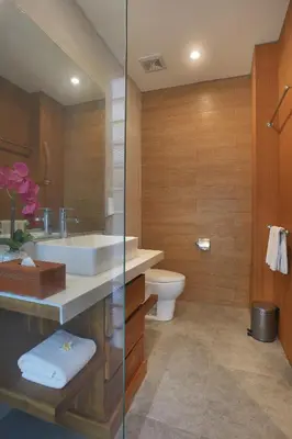a bathroom with a sink and a toilet at The Wina Villa Seminyak by The Wina Resorts in Seminyak