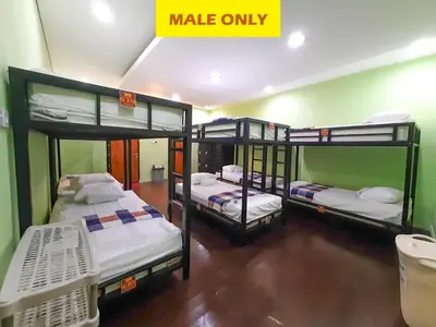 three bunk beds in a room with a sign that says make only at The Legian 777 in Legian