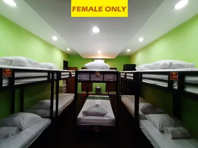 a room with four bunk beds with a sign that reads female only at The Legian 777 in Legian